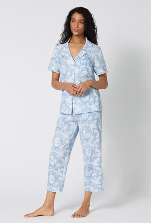 A Lady Wearing Minuet Toile Short Sleeve Classic Stretch Jersey Cropped Pj Set facing front in a side angled pose