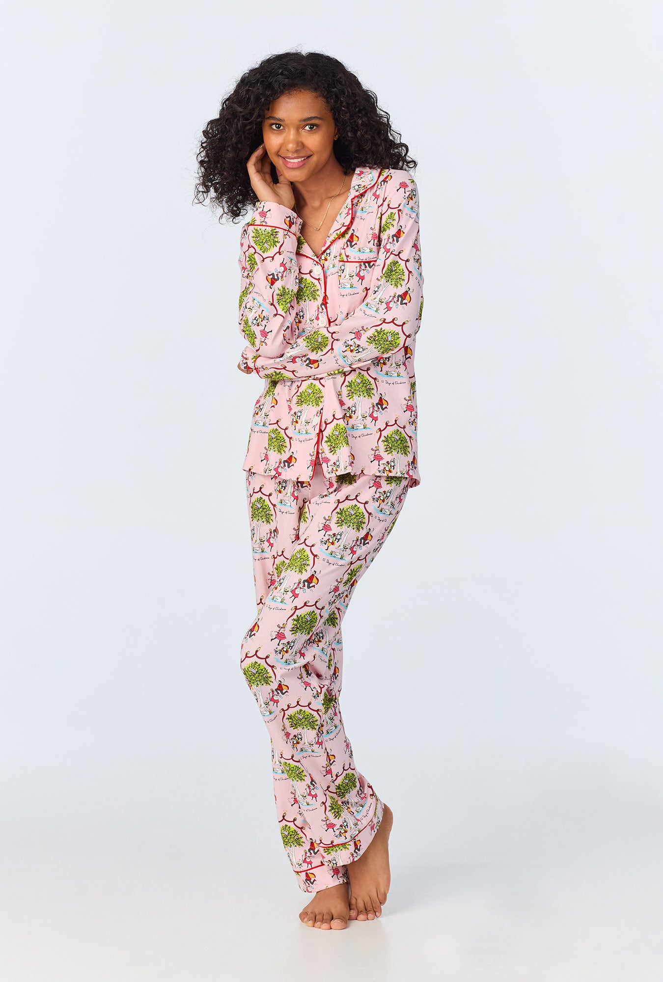 A lady wearing Long Sleeve Classic Stretch Jersey PJ Set with twelve days of christmas print