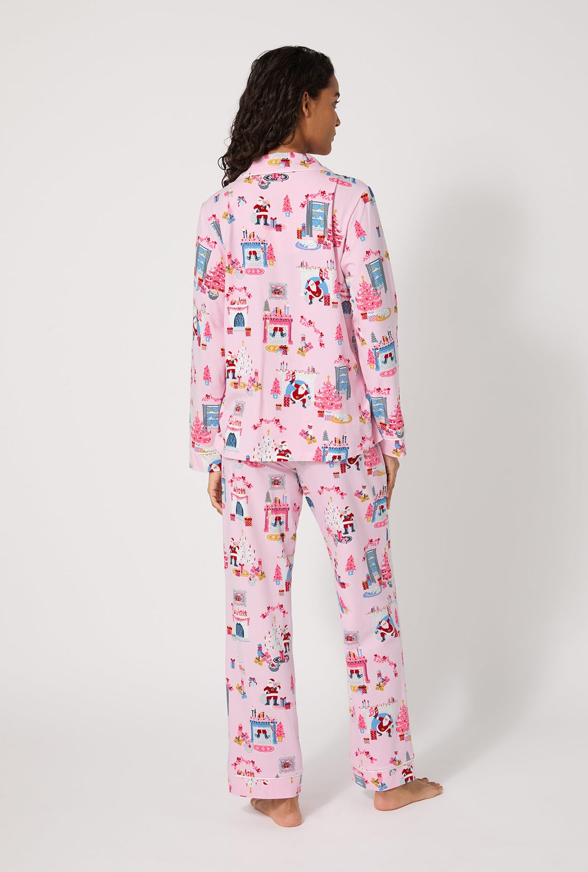 A lady wearing Must Be Santa Long Sleeve Classic Stretch Jersey Pj Set