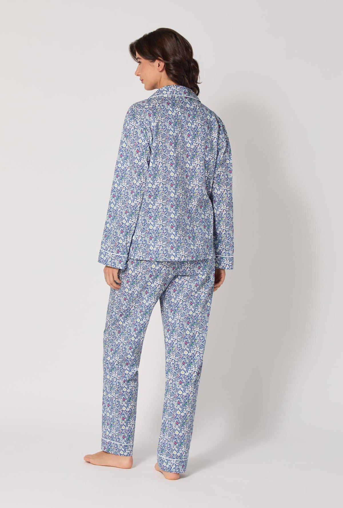 A lady wearing June's Meadow Long Sleeve Classic Woven Tana Lawn® Pj Set Made With Liberty Fabric