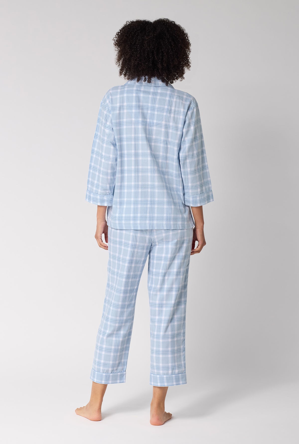 A lady wearing Meadow Haze Plaid 3/4 Sleeve Classic Woven Portuguese Flannel Cropped Pj Set back view