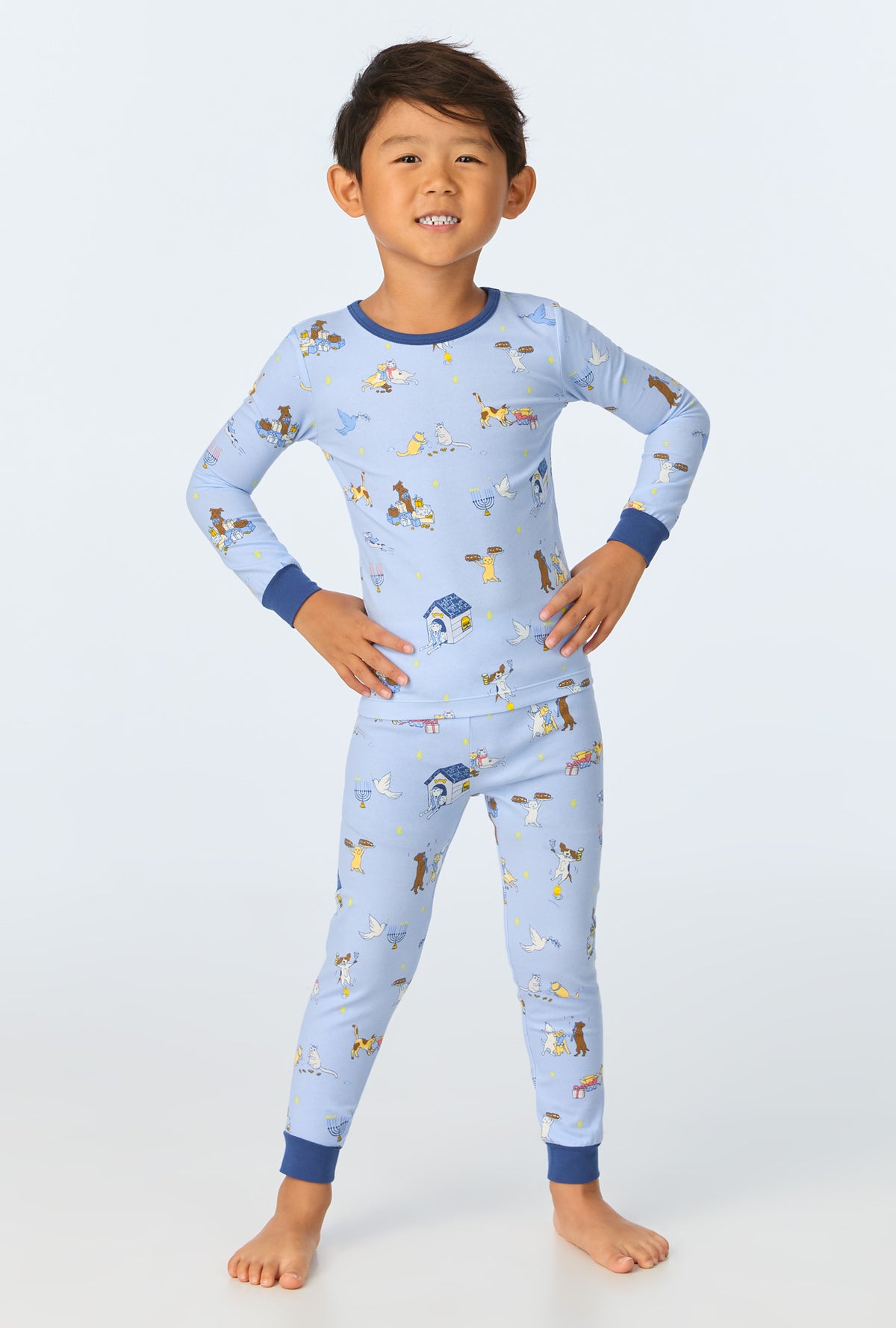 A child wearing Festive of Lights Long Sleeve Stretch Jersey Kids PJ Set