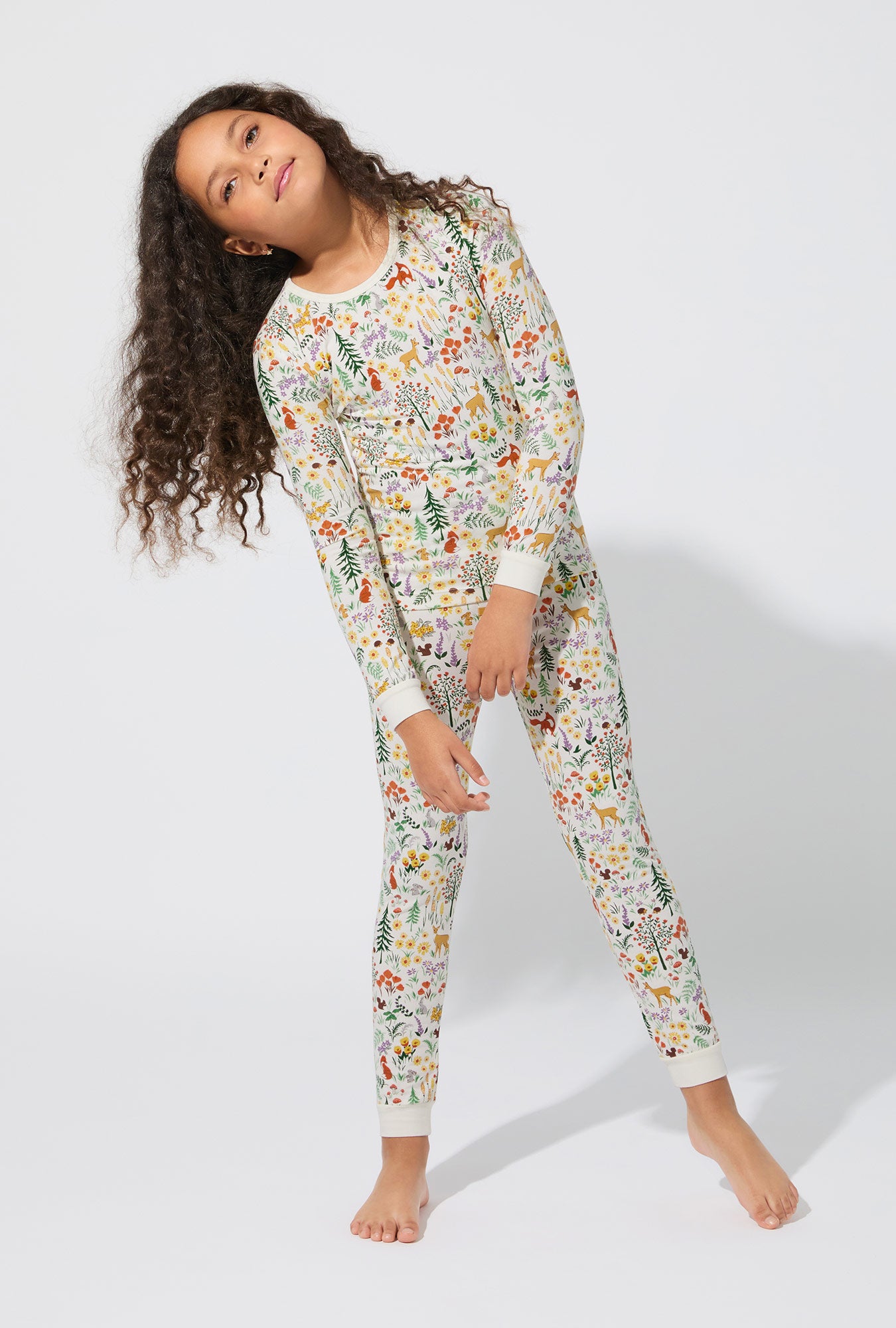 A girl wearing Forest Trails Long Sleeve Stretch Jersey Kids PJ Set