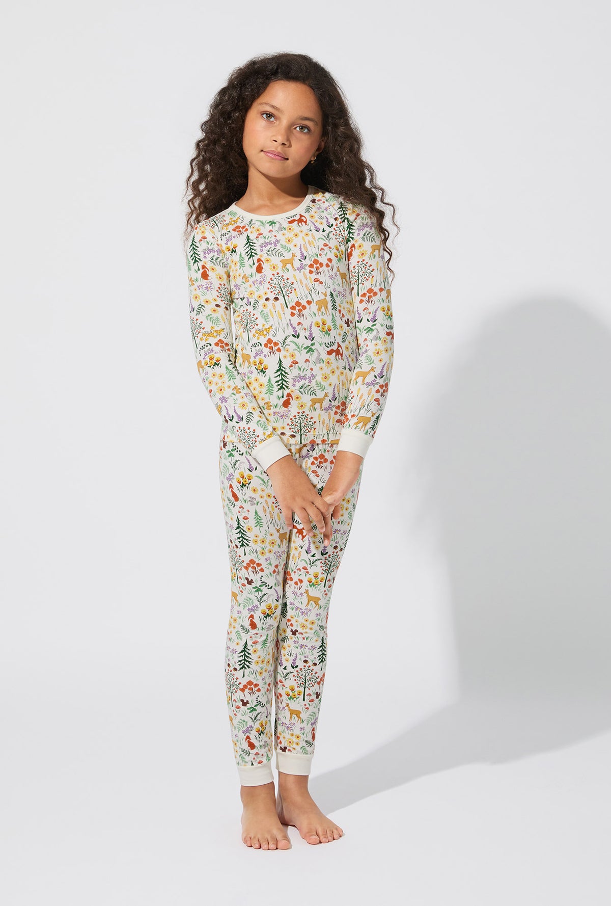 A girl wearing Forest Trails Long Sleeve Stretch Jersey Kids PJ Set