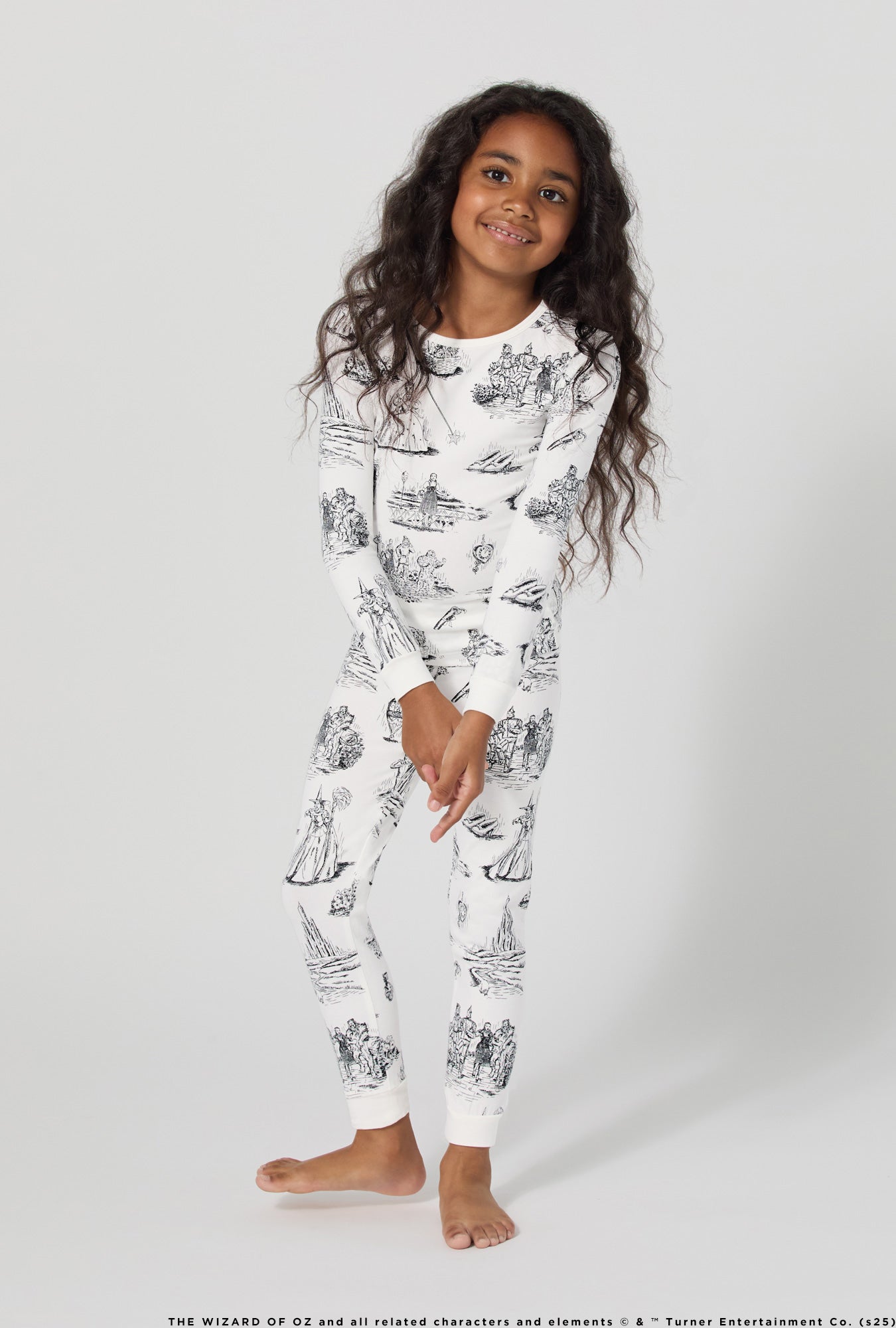 A girl wearing Wizard Of Oz Long Sleeve Stretch Jersey Kids Pj Set