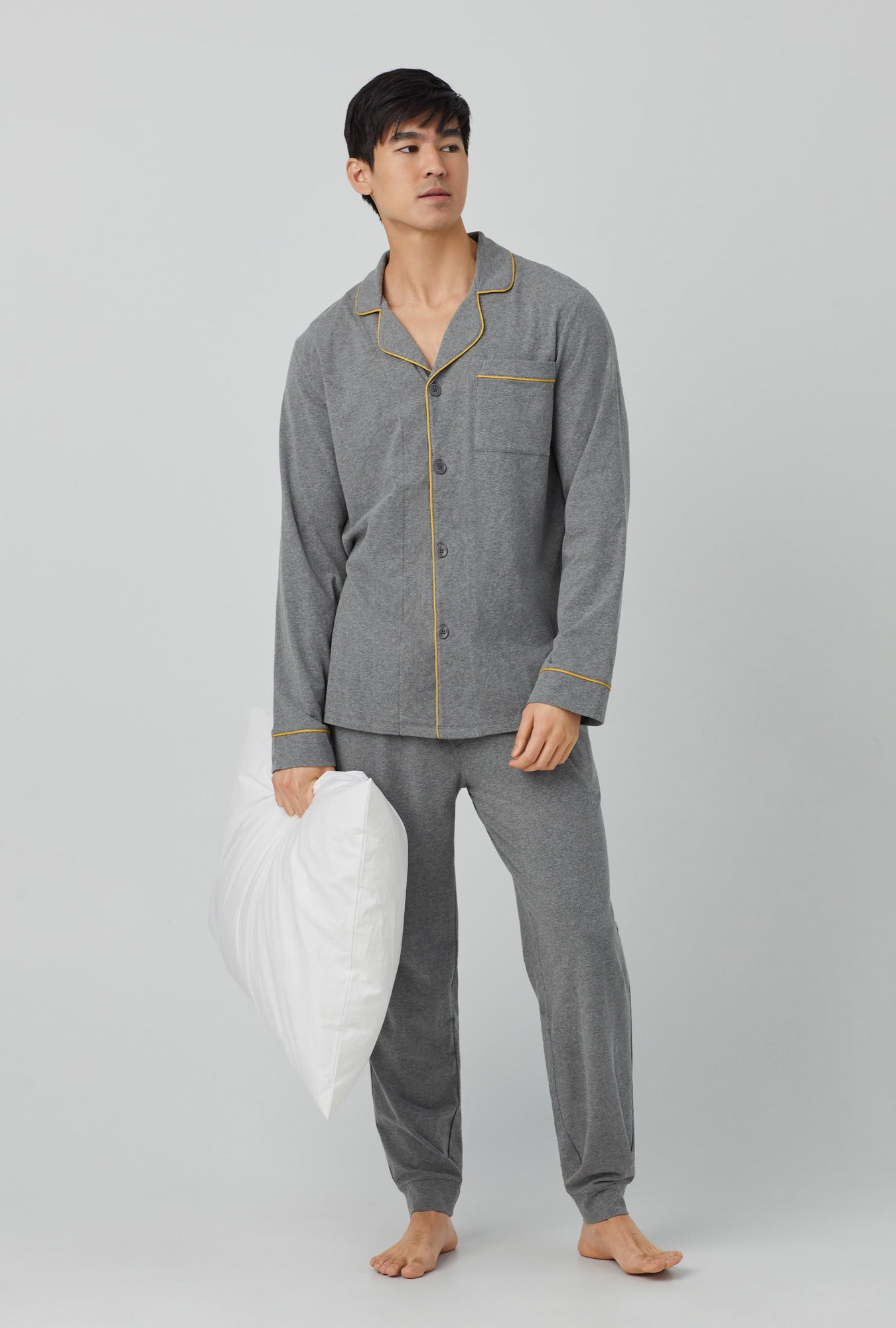 A men wearing grey  Long Sleeve and Jogger Stretch Jersey PJ Set with Charcoal Heather print