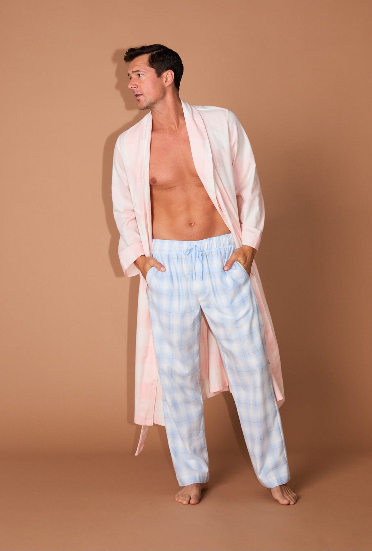 A man wearing Blue Mountain Plaid Men&#39;s Woven Portuguese Flannel PJ Pant
