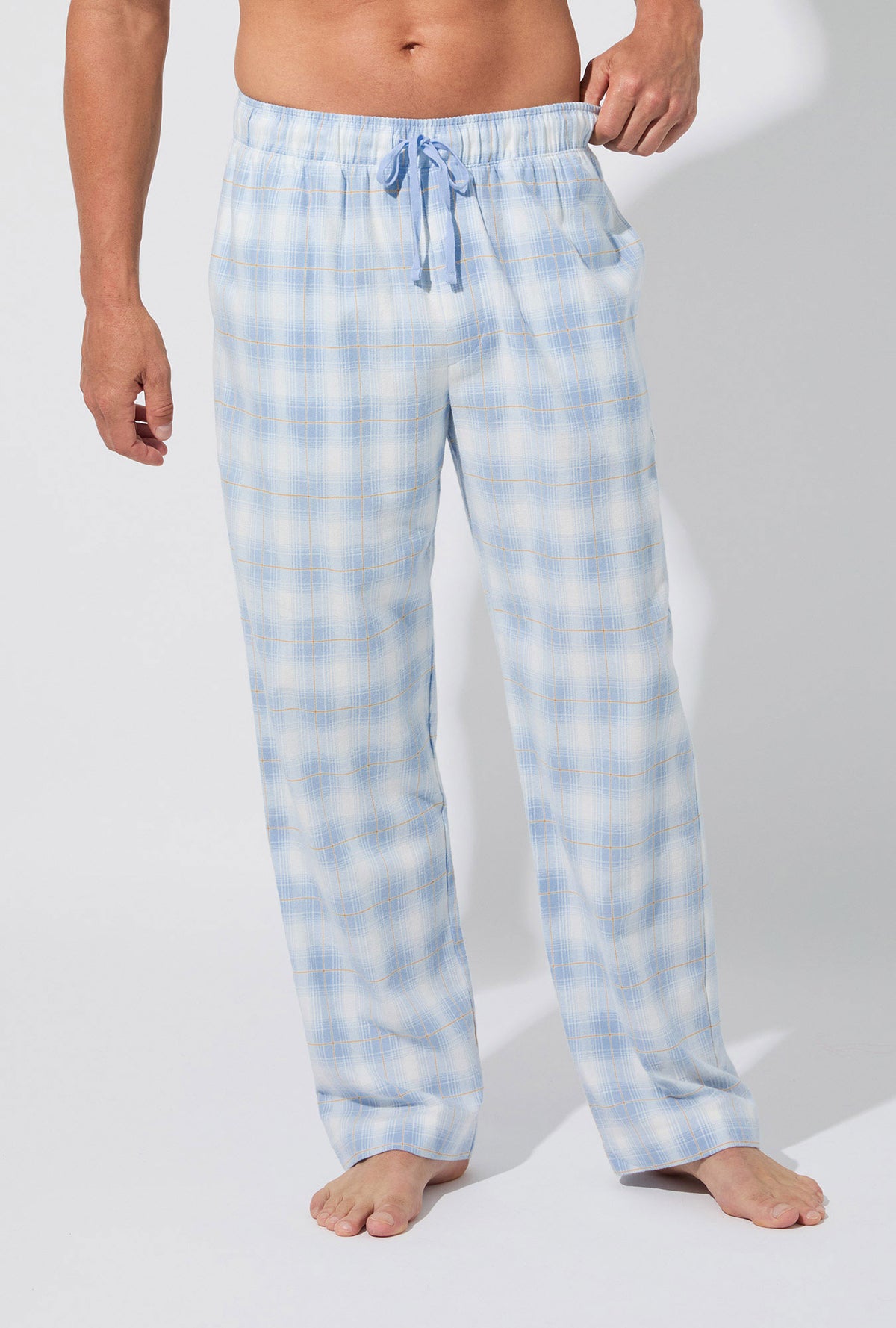 A man wearing Blue Mountain Plaid Men&#39;s Woven Portuguese Flannel PJ Pant