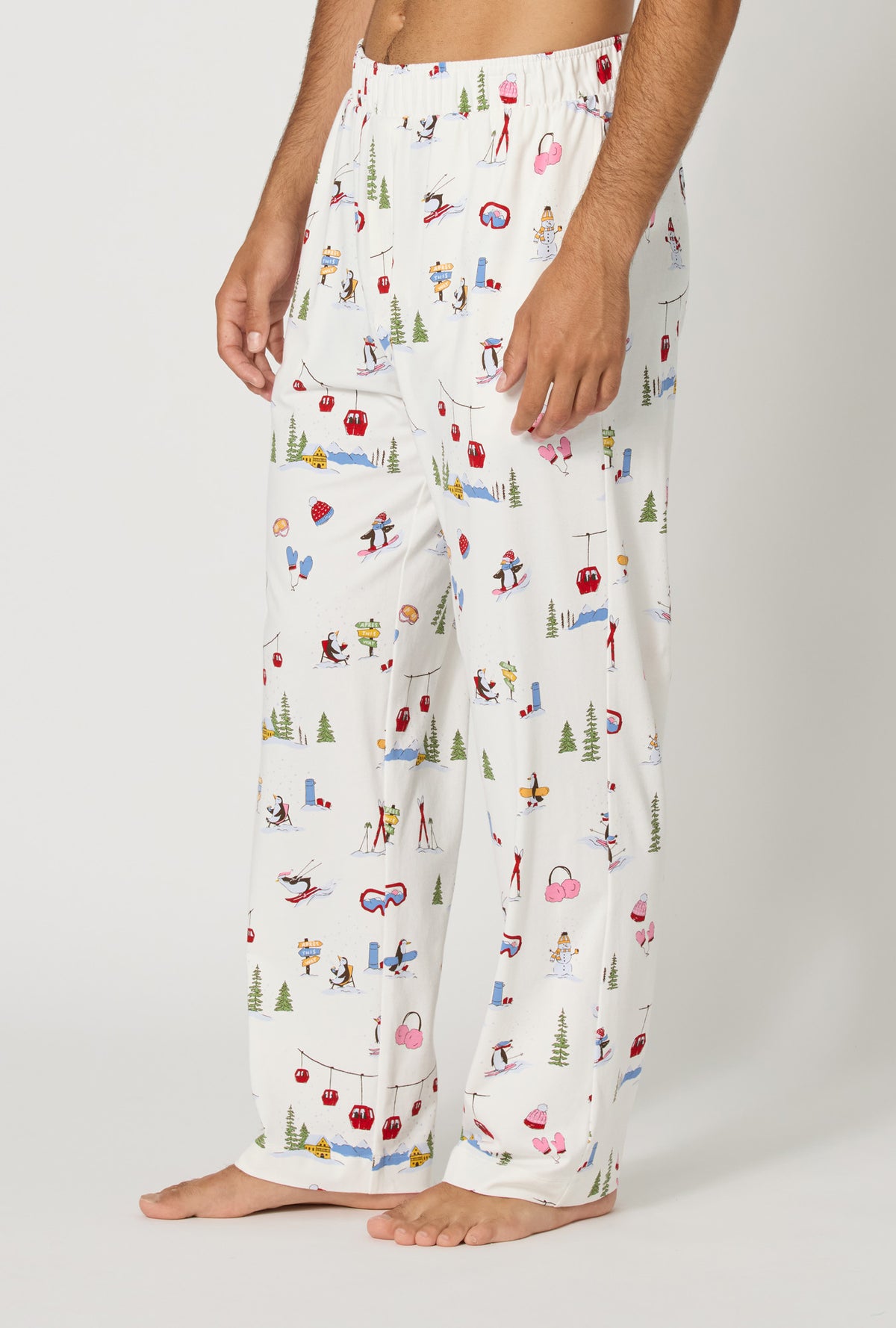 A man wearing Snow Much Fun Men's Stretch Jersey Pj Pant side view