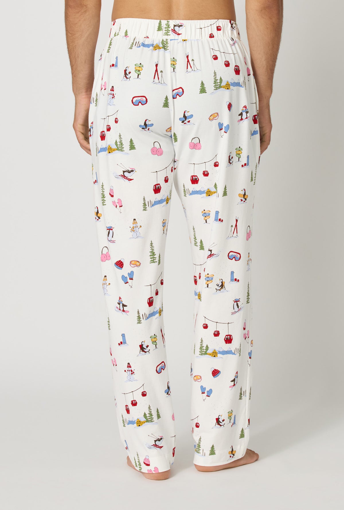 A man wearing Snow Much Fun Men's Stretch Jersey Pj Pant back view