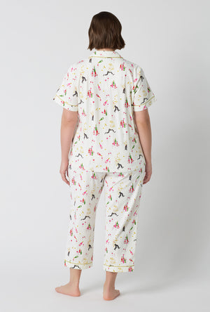 A Lady Wearing Plus Size Bar A Vin Short Sleeve Classic Stretch Jersey Cropped Pj Set in a back facing pose