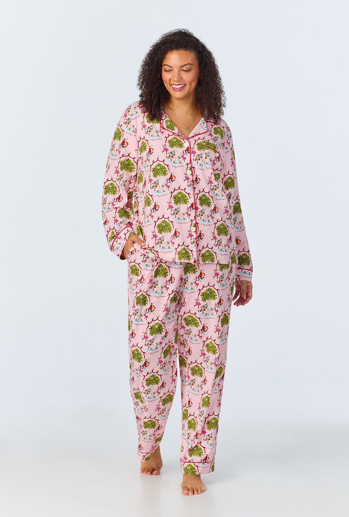 A lady wearing Long Sleeve Classic Stretch Jersey PJ Set with twelve days of christmas print
