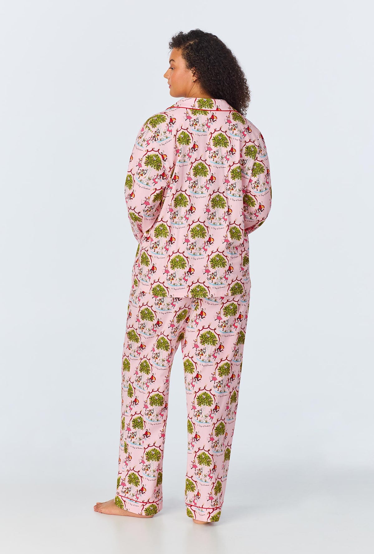 A lady wearing Long Sleeve Classic Stretch Jersey PJ Set with twelve days of christmas print