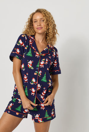 A lady wearing Santa's Night Out Short Sleeve Classic Shorty Stretch Jersey Pj Set closer look with pant
