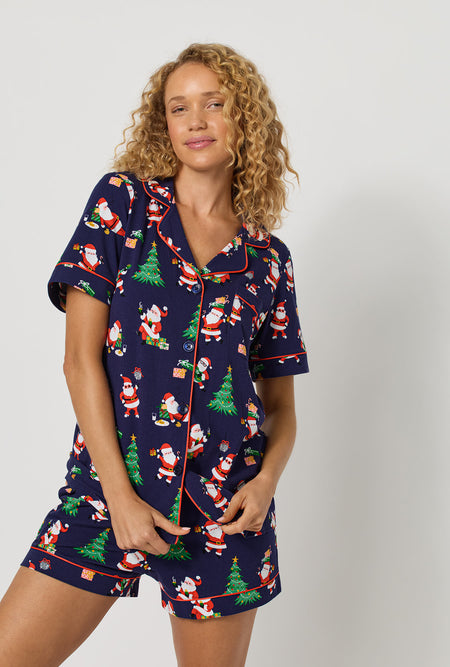 A lady wearing Santa's Night Out Short Sleeve Classic Shorty Stretch Jersey Pj Set closer look with pant