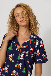 A lady wearing Santa's Night Out Short Sleeve Classic Shorty Stretch Jersey Pj Set closer look
