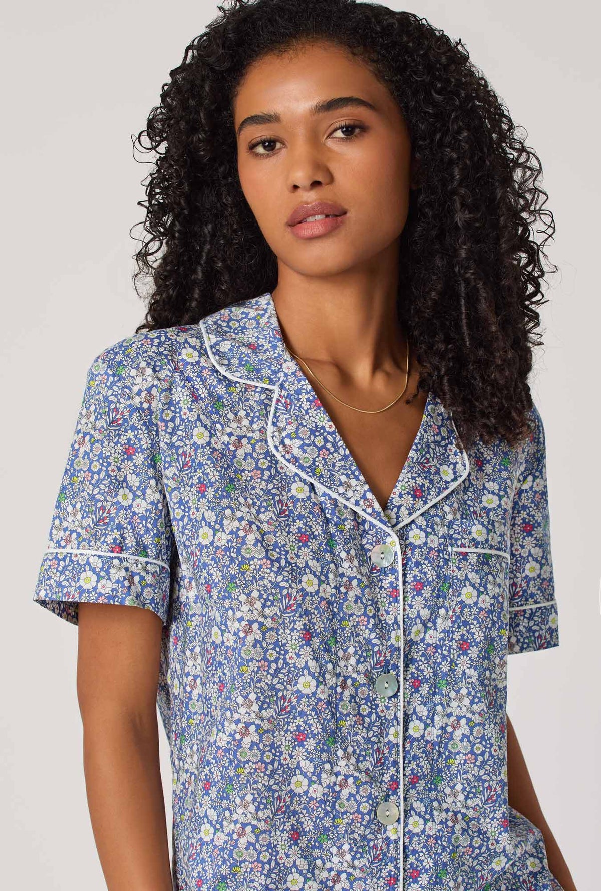 A Lady wearing June's Meadow Short Sleeve Classic Woven Tana Lawn® Cropped Pj Set Made With Liberty Fabric
