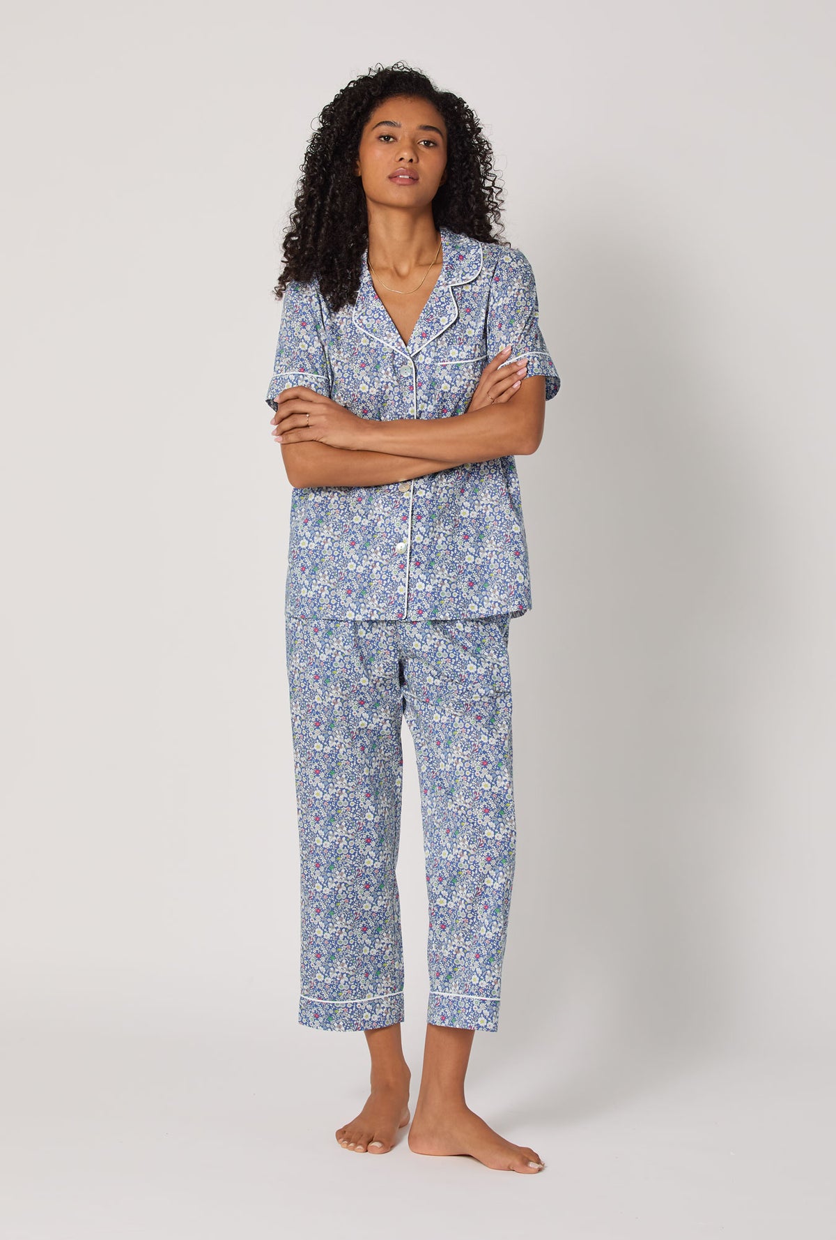 A Lady wearing June's Meadow Short Sleeve Classic Woven Tana Lawn® Cropped Pj Set Made With Liberty Fabric