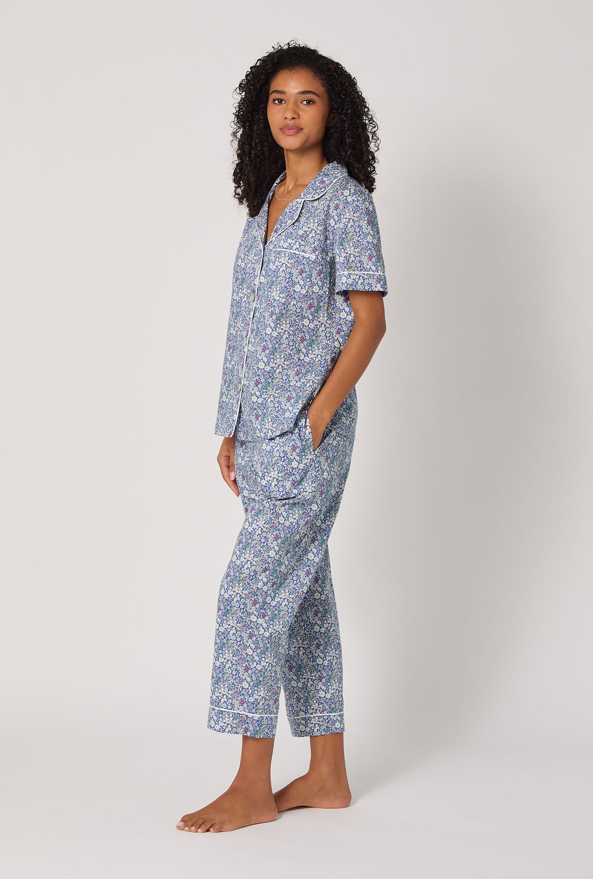 A Lady wearing June's Meadow Short Sleeve Classic Woven Tana Lawn® Cropped Pj Set Made With Liberty Fabric