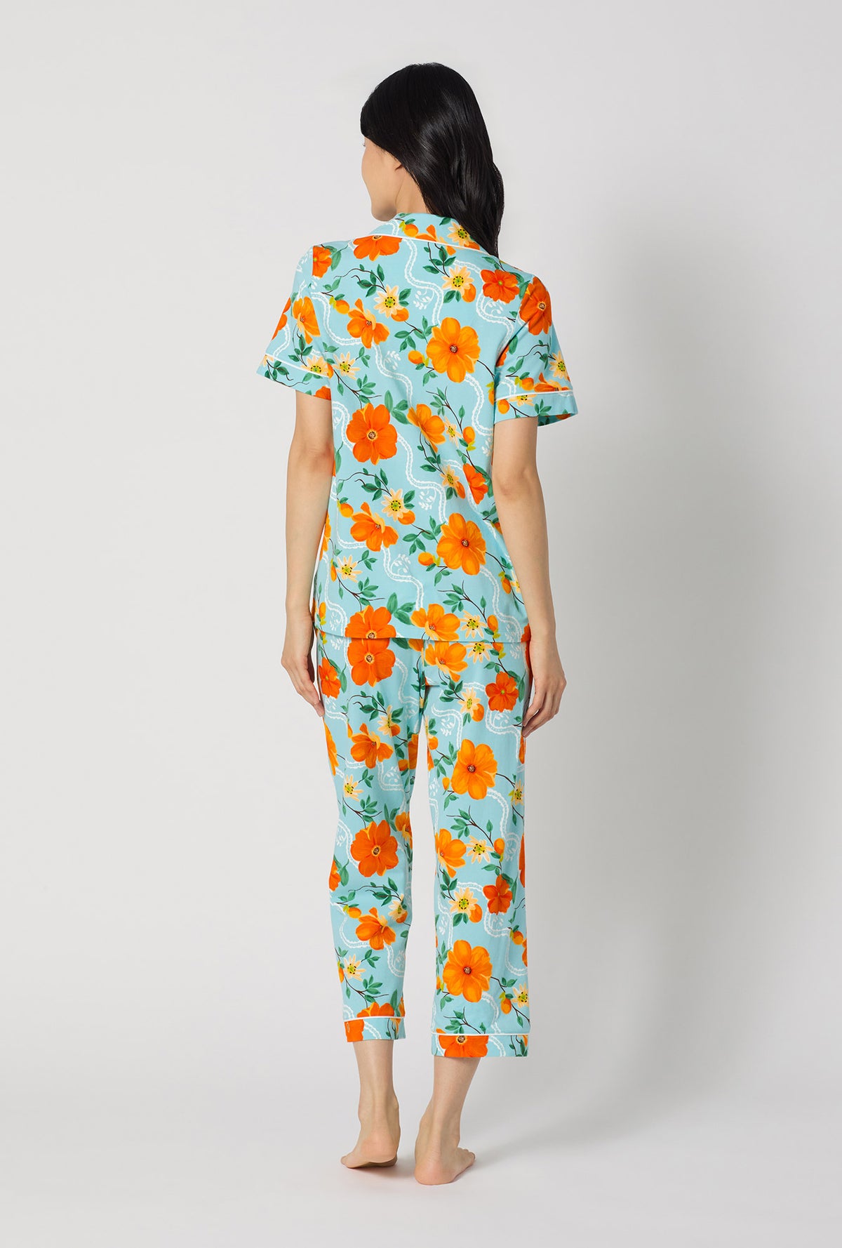 A lady wearing Golden Breeze Short Sleeve Classic Stretch Jersey Cropped Pj Set back view