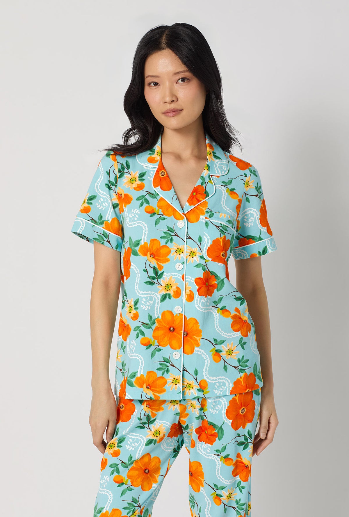 A lady wearing Golden Breeze Short Sleeve Classic Stretch Jersey Cropped Pj Set closer look