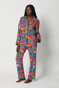 A lady wearing BedHead x Trina Turk Jungle Long Sleeve Classic Stretch Jersey Pj Set