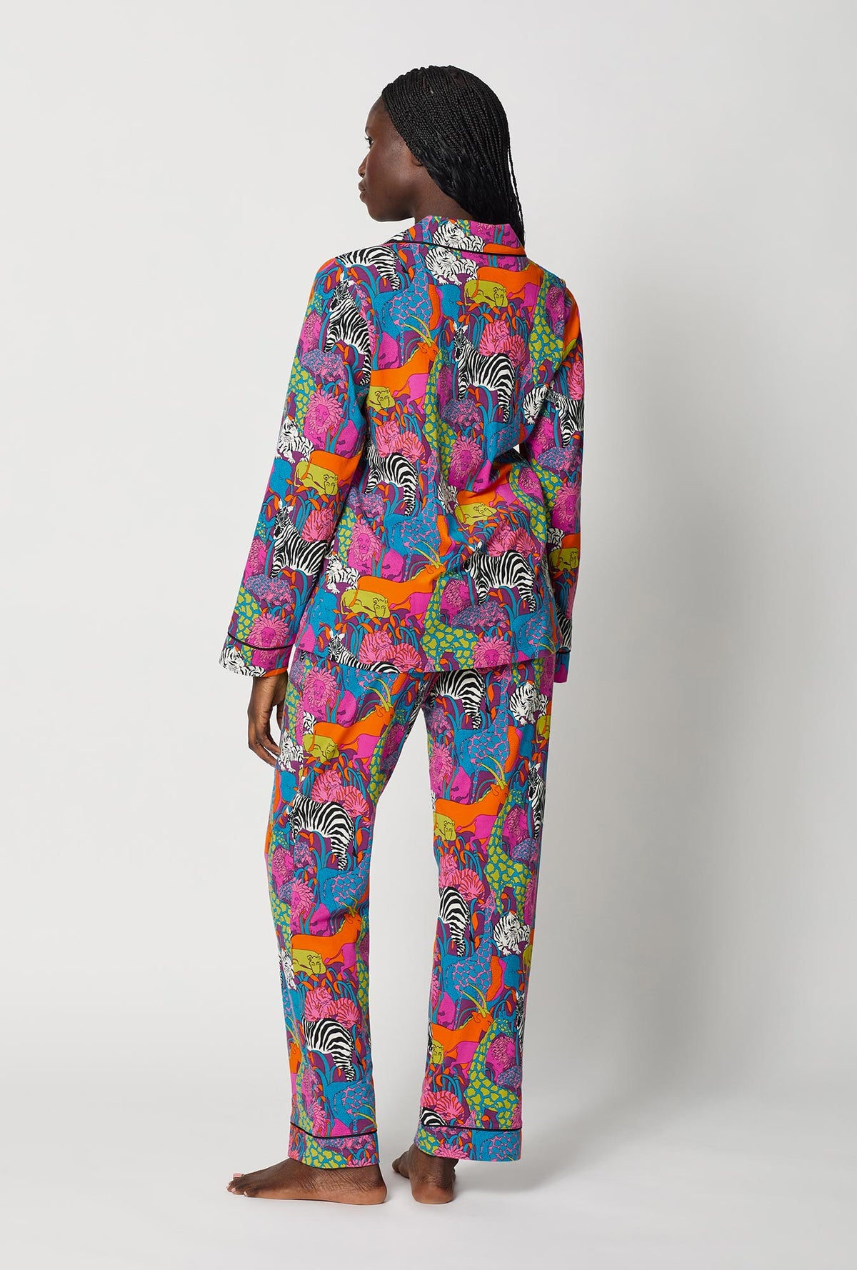A lady wearing BedHead x Trina Turk Jungle Long Sleeve Classic Stretch Jersey Pj Set