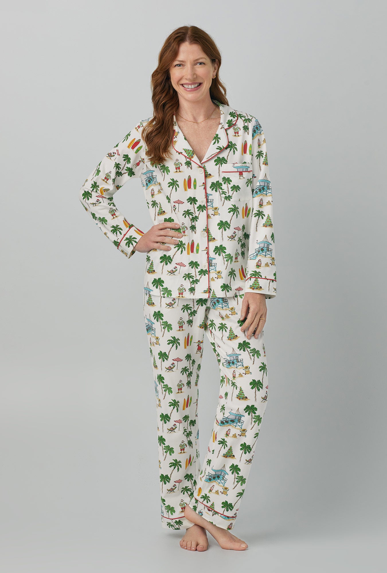 A lady wearing white Long Sleeve Classic Stretch Jersey PJ Set with Deck The Palms print