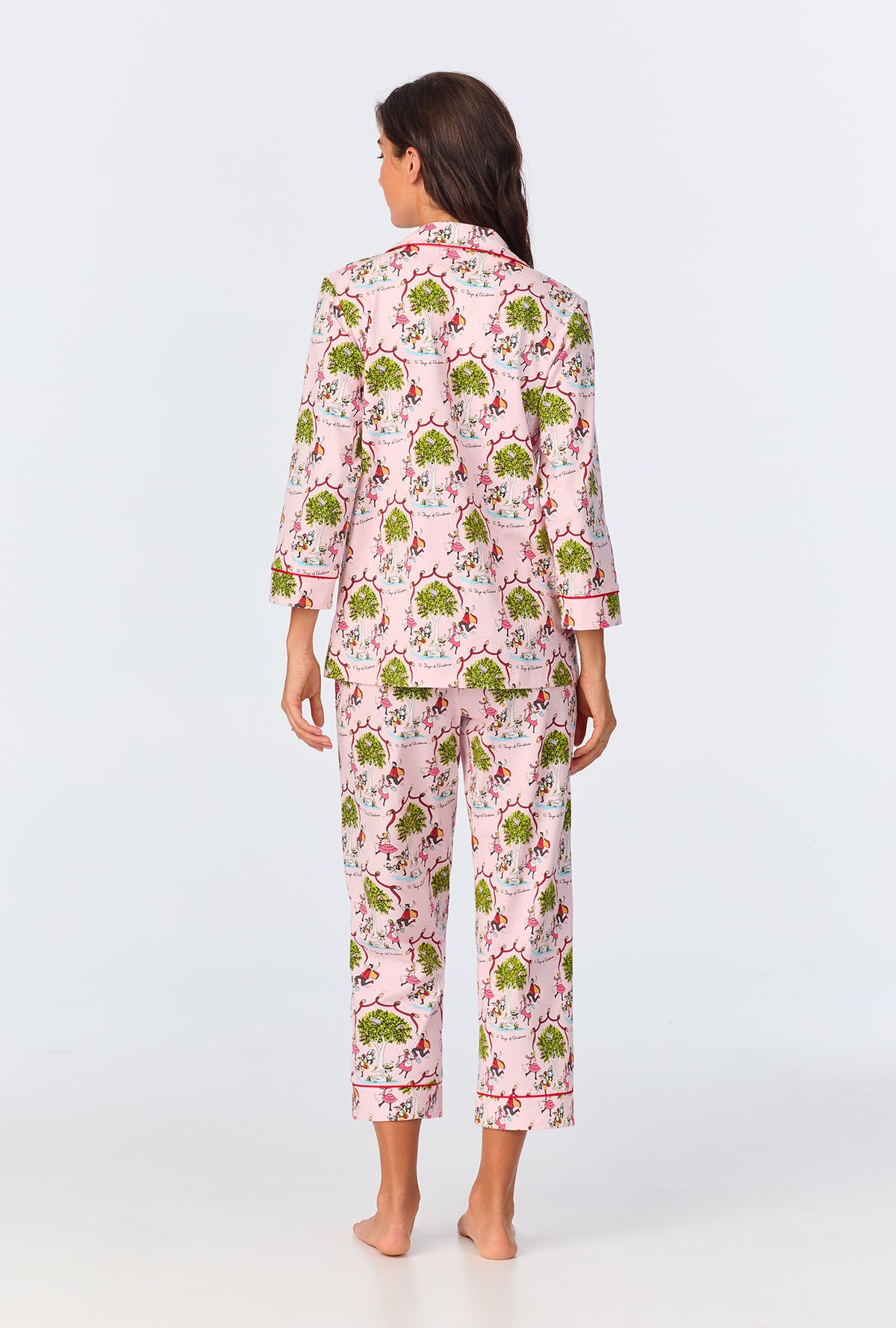 A lady wearing Twelve Days Of Christmas 3/4 Sleeve Classic Stretch Jersey Cropped PJ Set