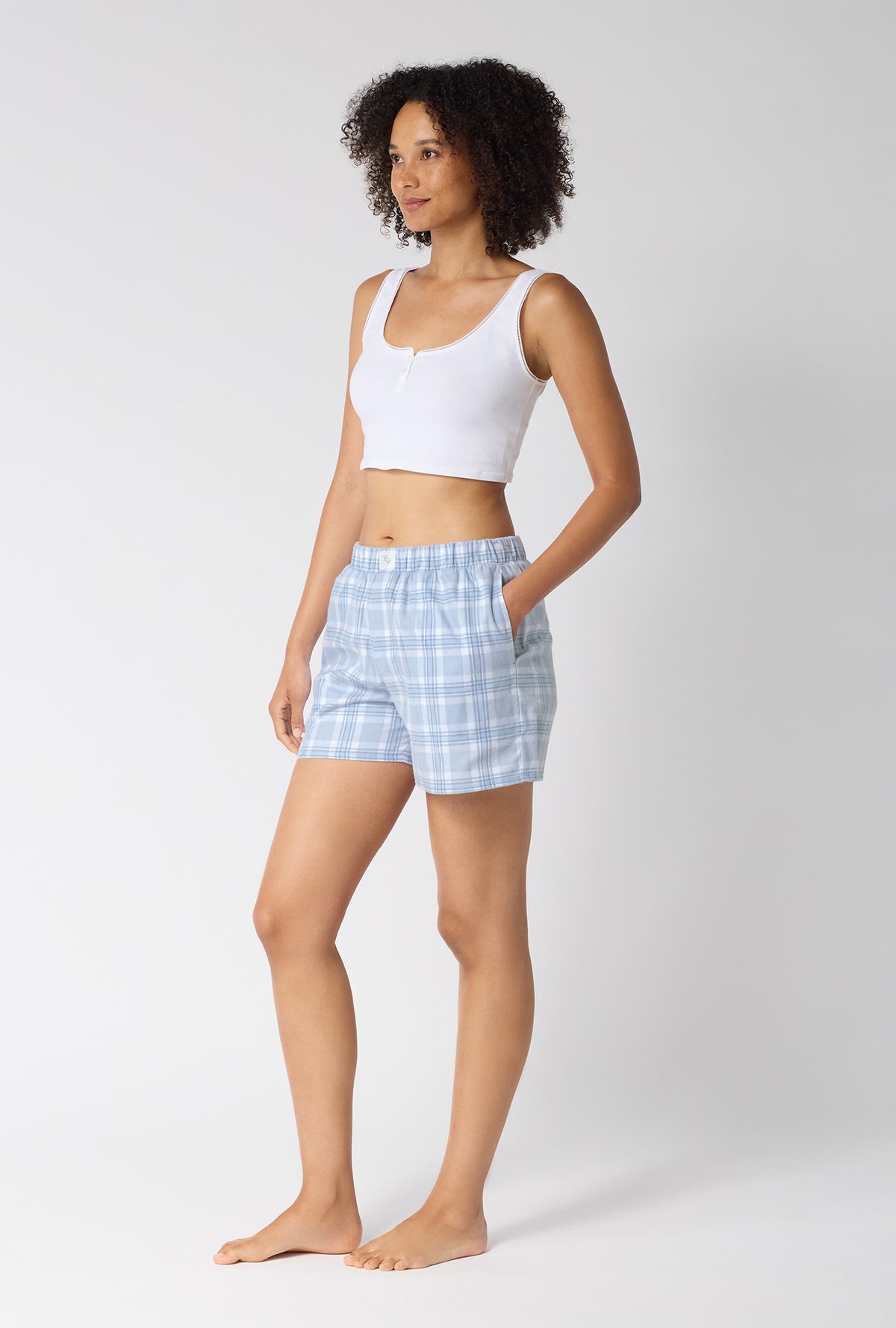 A lady wearing Meadow Haze Plaid Woven Portuguese Flannel Boxer Short looking side