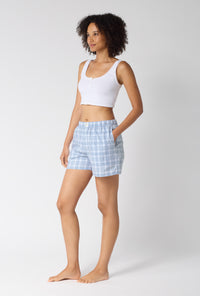 A lady wearing Meadow Haze Plaid Woven Portuguese Flannel Boxer Short looking side