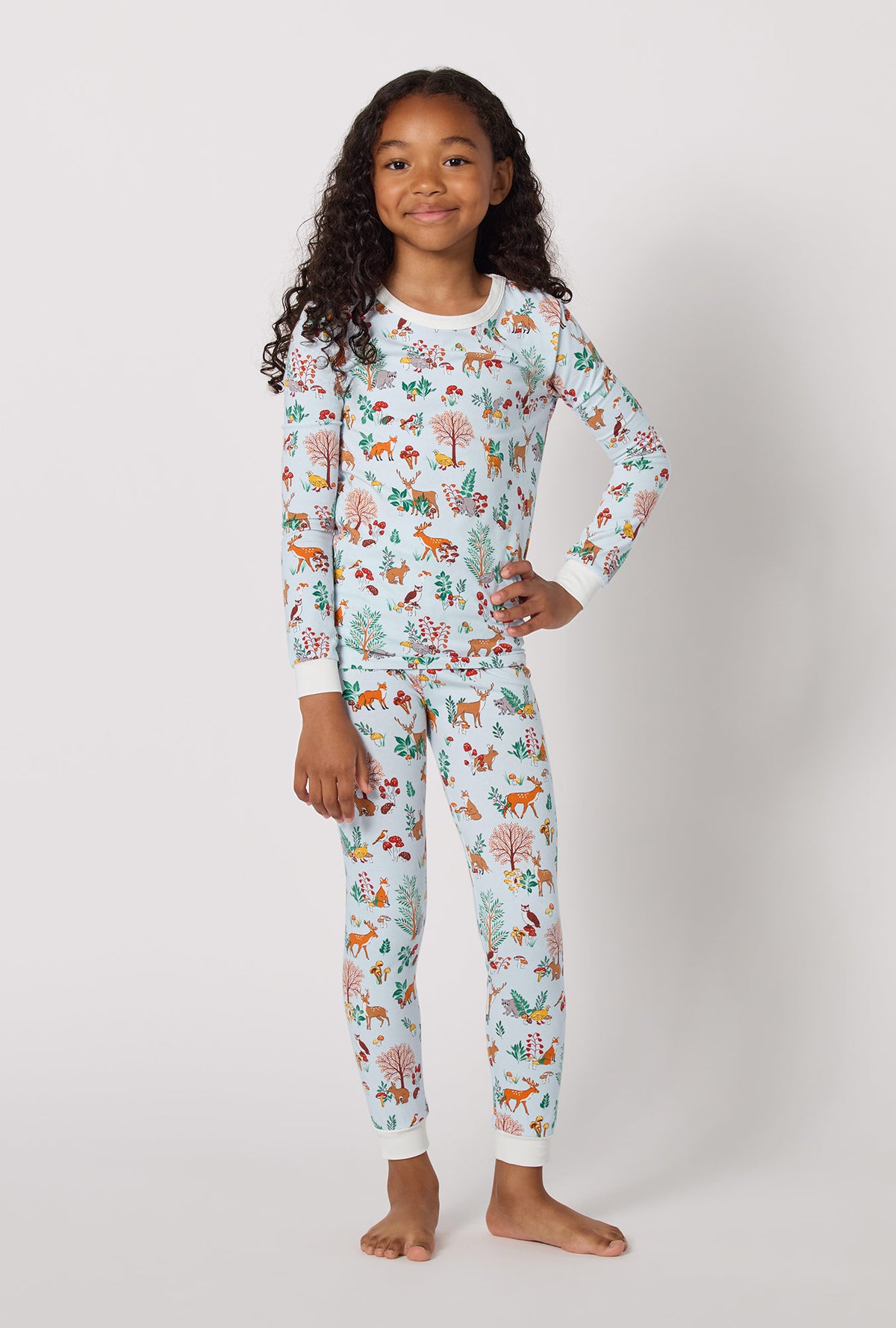 A lady wearing Woodland Wonder Long Sleeve Stretch Jersey Kids Pj Set