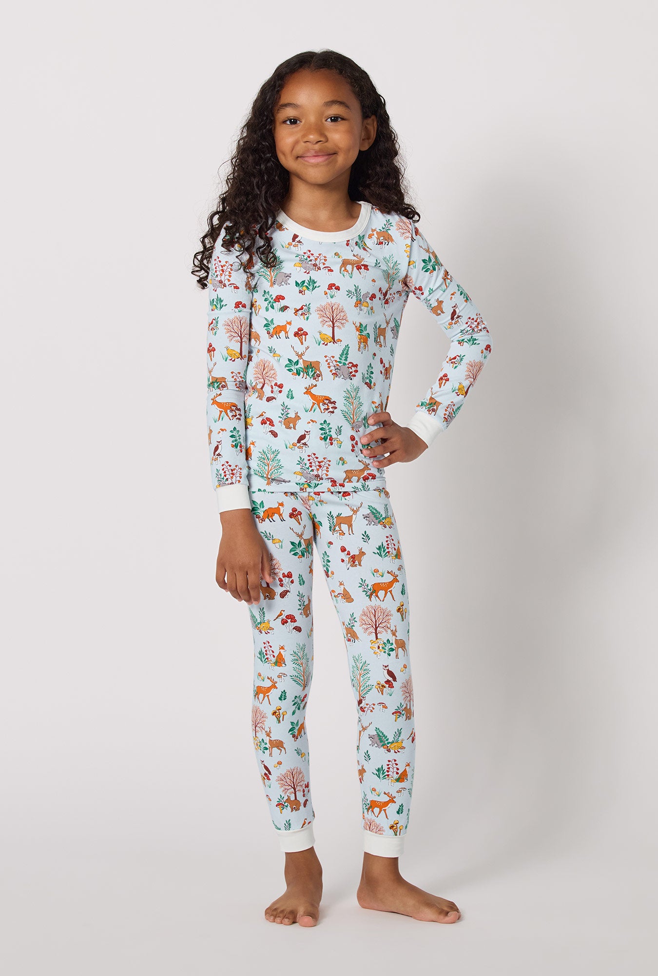 A lady wearing Woodland Wonder Long Sleeve Stretch Jersey Kids Pj Set