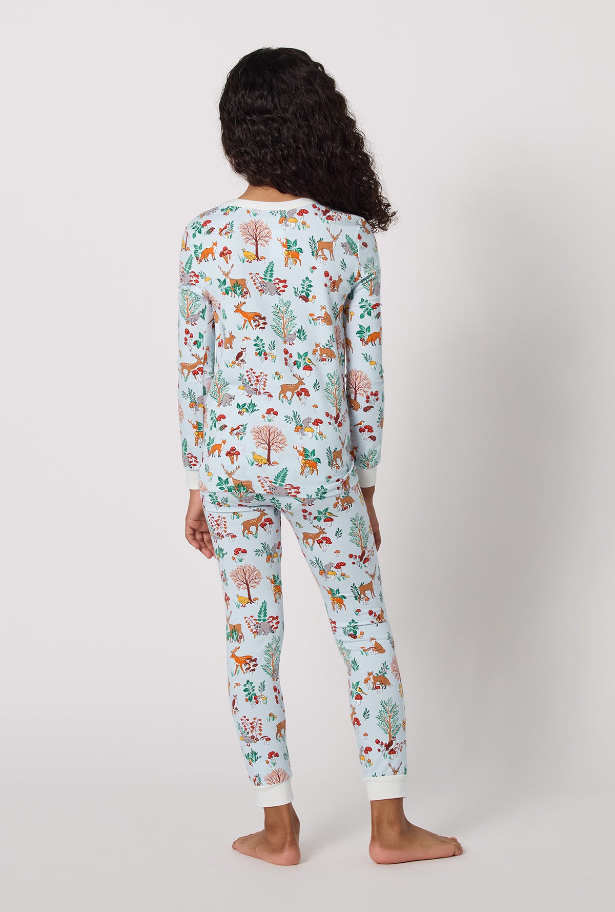 A lady wearing Woodland Wonder Long Sleeve Stretch Jersey Kids Pj Set back view