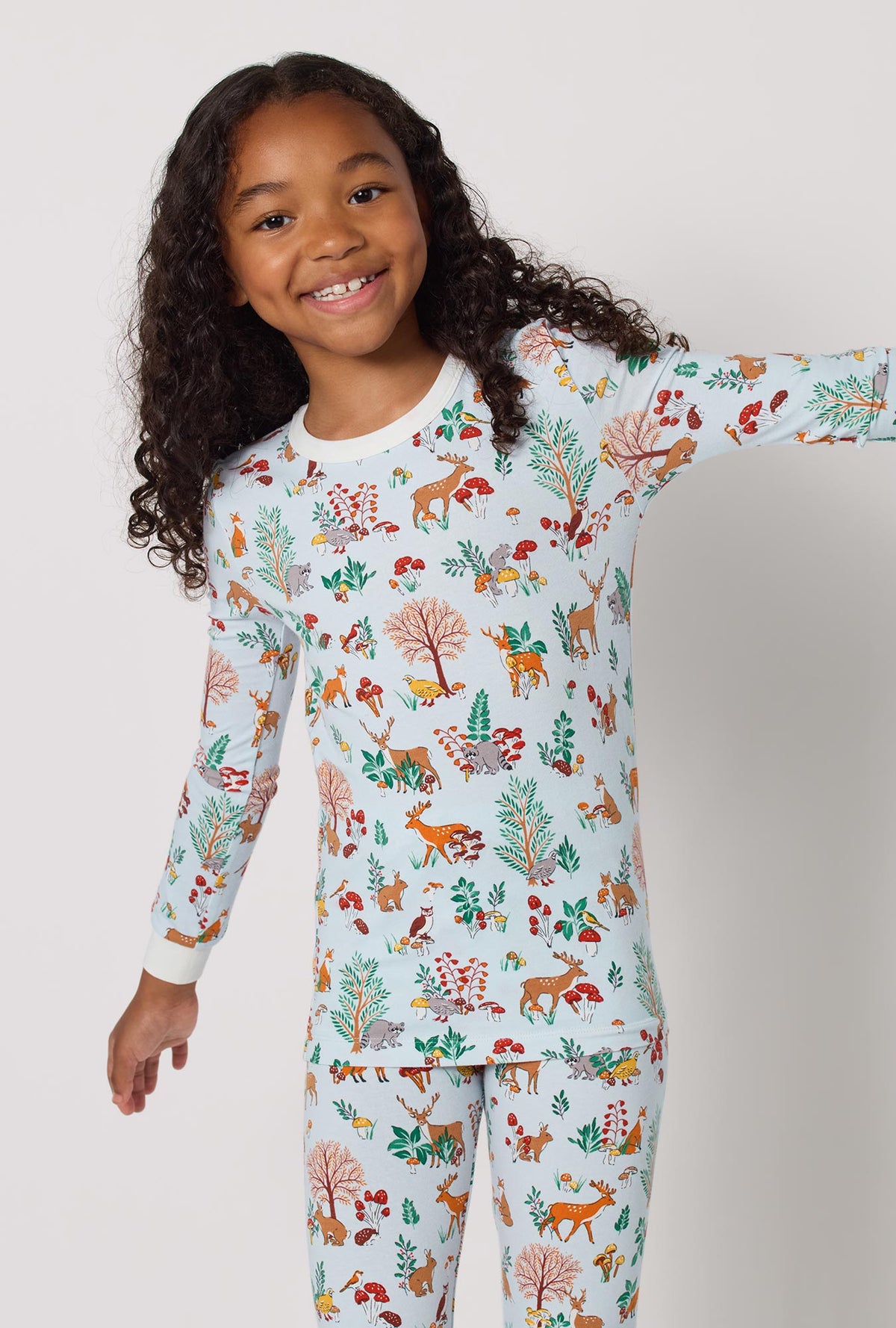 A lady wearing Woodland Wonder Long Sleeve Stretch Jersey Kids Pj Set closer look