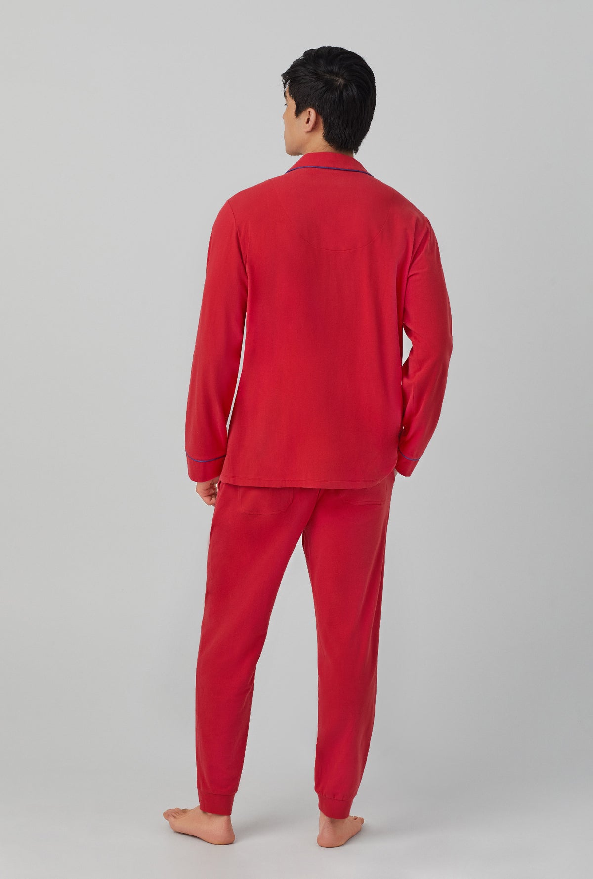 A men wearing red Long Sleeve and Jogger Stretch Jersey PJ Set with Samba Red print