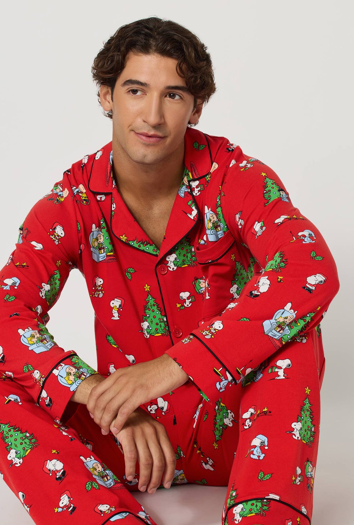 A lady wearing Merry, Beagle, & Bright Men's Long Sleeve Classic Stretch Jersey Pj Set sitting down