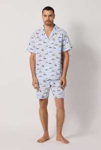 A man wearing Catch A Wave, Snoopy Men's Short Sleeve Woven Cotton Poplin Short Pj Set