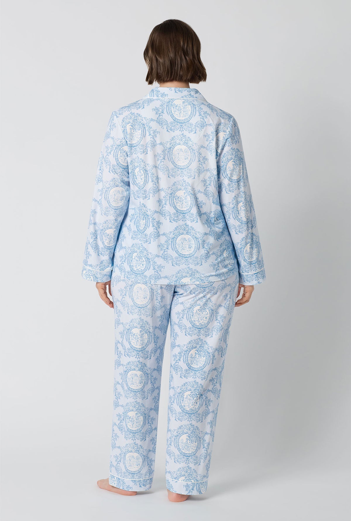 A Lady Wearing Plus Size Minuet Toile Long Sleeve Classic Stretch Jersey Pj Set in a full back view pose