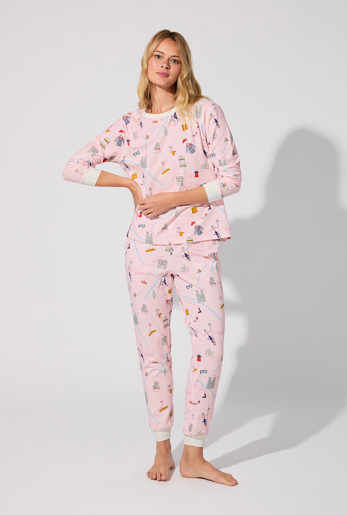 A lady wearing 48 Hrs In Paris  Long Sleeve Pullover Crew and Jogger Stretch Jersey PJ Set
