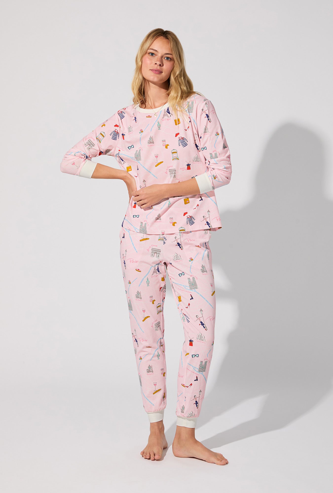 A lady wearing 48 Hrs In Paris  Long Sleeve Pullover Crew and Jogger Stretch Jersey PJ Set