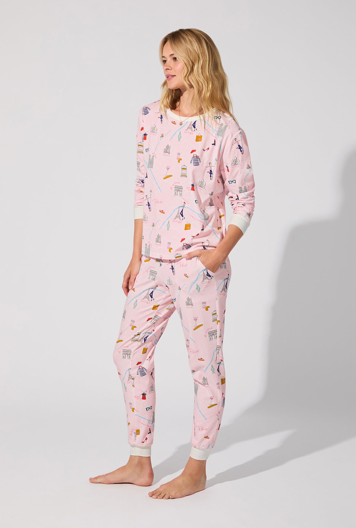 A lady wearing 48 Hrs In Paris  Long Sleeve Pullover Crew and Jogger Stretch Jersey PJ Set