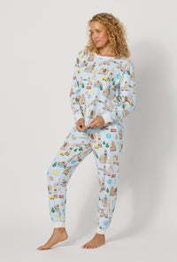 A lady wearing Gingerbread City Long Sleeve Pullover Crew And Jogger Stretch Jersey Pj Set looking side