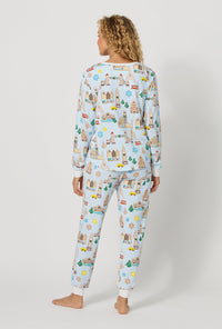 A lady wearing Gingerbread City Long Sleeve Pullover Crew And Jogger Stretch Jersey Pj Set back view