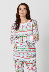 A lady wearing Peanuts® Winter Parade Long Sleeve Pullover Crew And Jogger Stretch Jersey Pj Set closer look