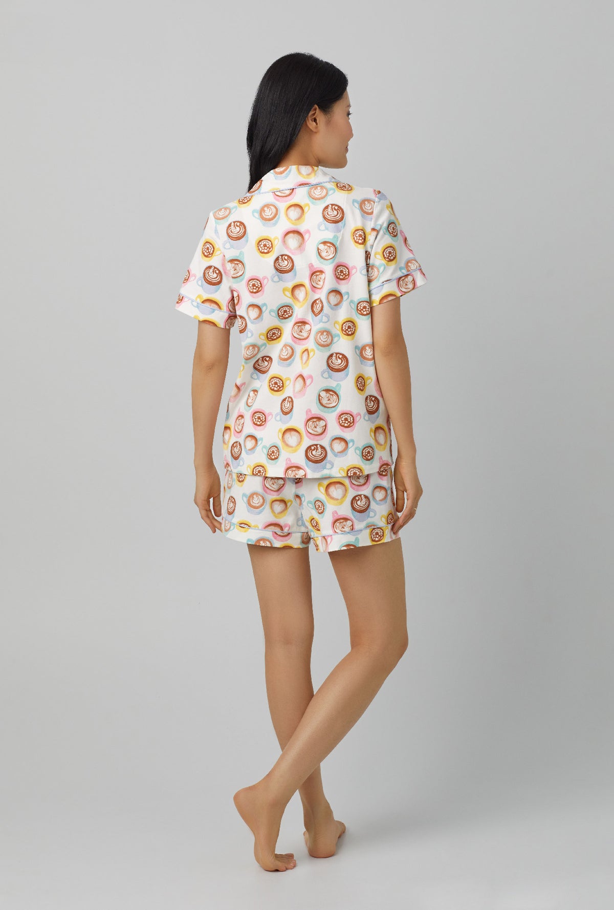 A lady wearing white short Sleeve Classic Stretch Jersey shorty PJ Set with Lots of latte print