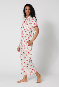 A Lady Wearing Celeste Short Sleeve Classic Woven Supersoft Cotton Poplin Cropped Pj Set facing front in a side angled walking pose