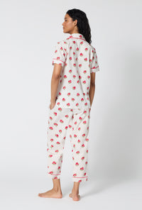 A Lady Wearing Celeste Short Sleeve Classic Woven Supersoft Cotton Poplin Cropped Pj Set turned back while looking to the side