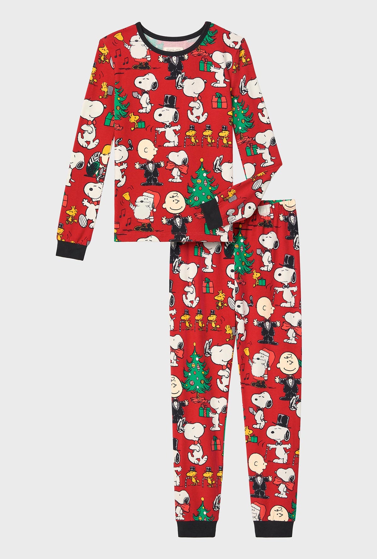 A child wearing Peanuts® Festive Fun Long Sleeve Stretch Jersey Kids PJ Set