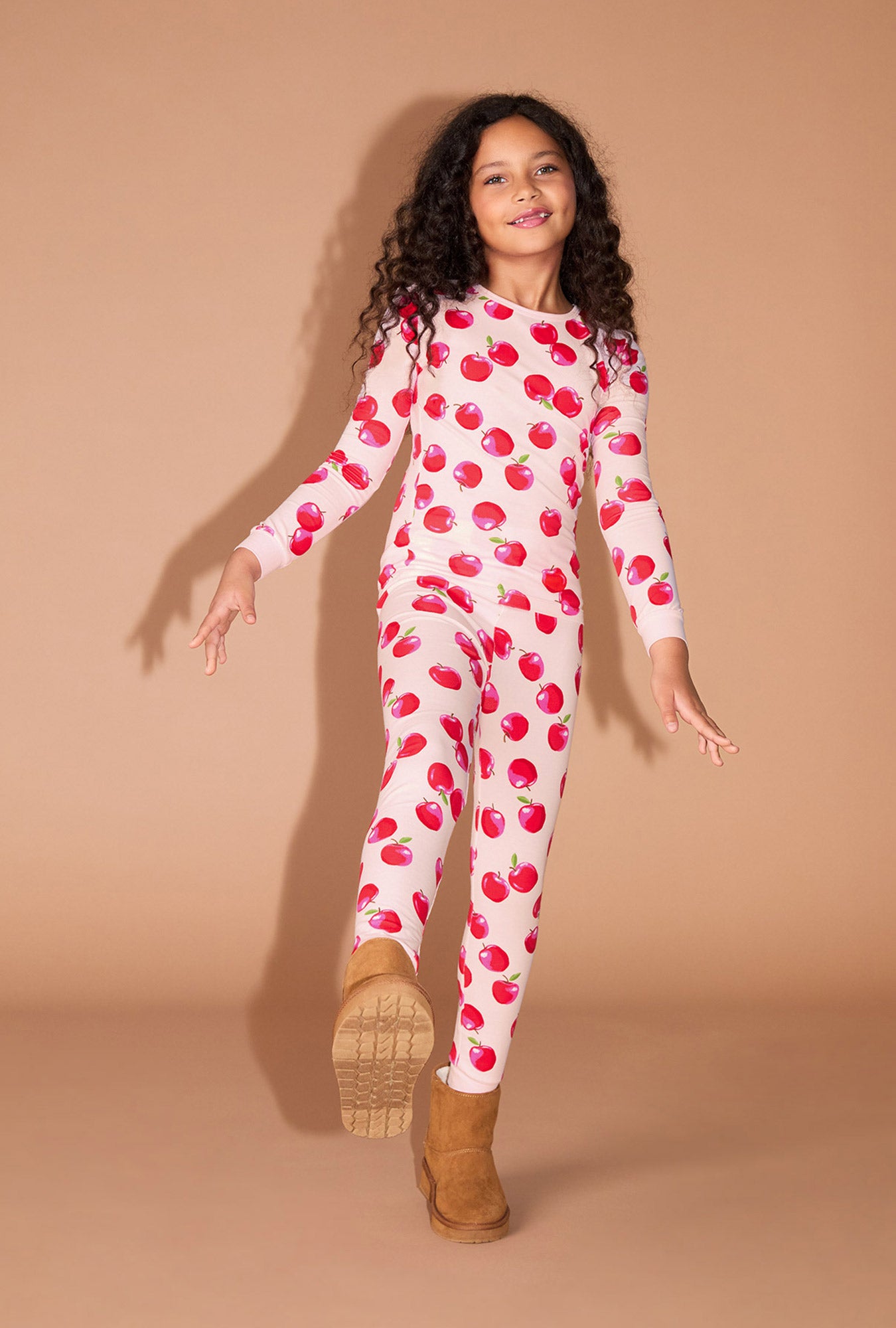 A girl wearing An Apple A Day Long Sleeve Stretch Jersey Kids PJ Set